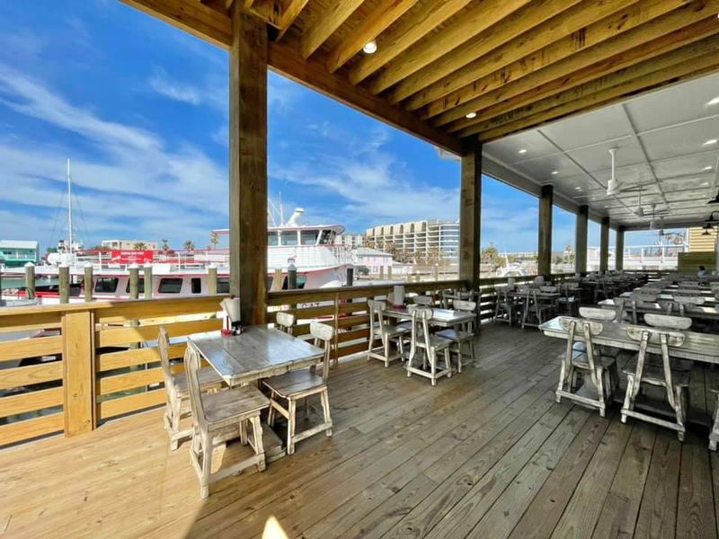 Watching Boats Unload the Daily Catch Right From Your Table Watching Boats Unload the Daily Catch Right From Your Table
