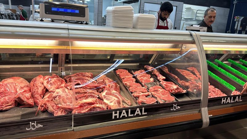 A Butcher Counter With Actual Butchers