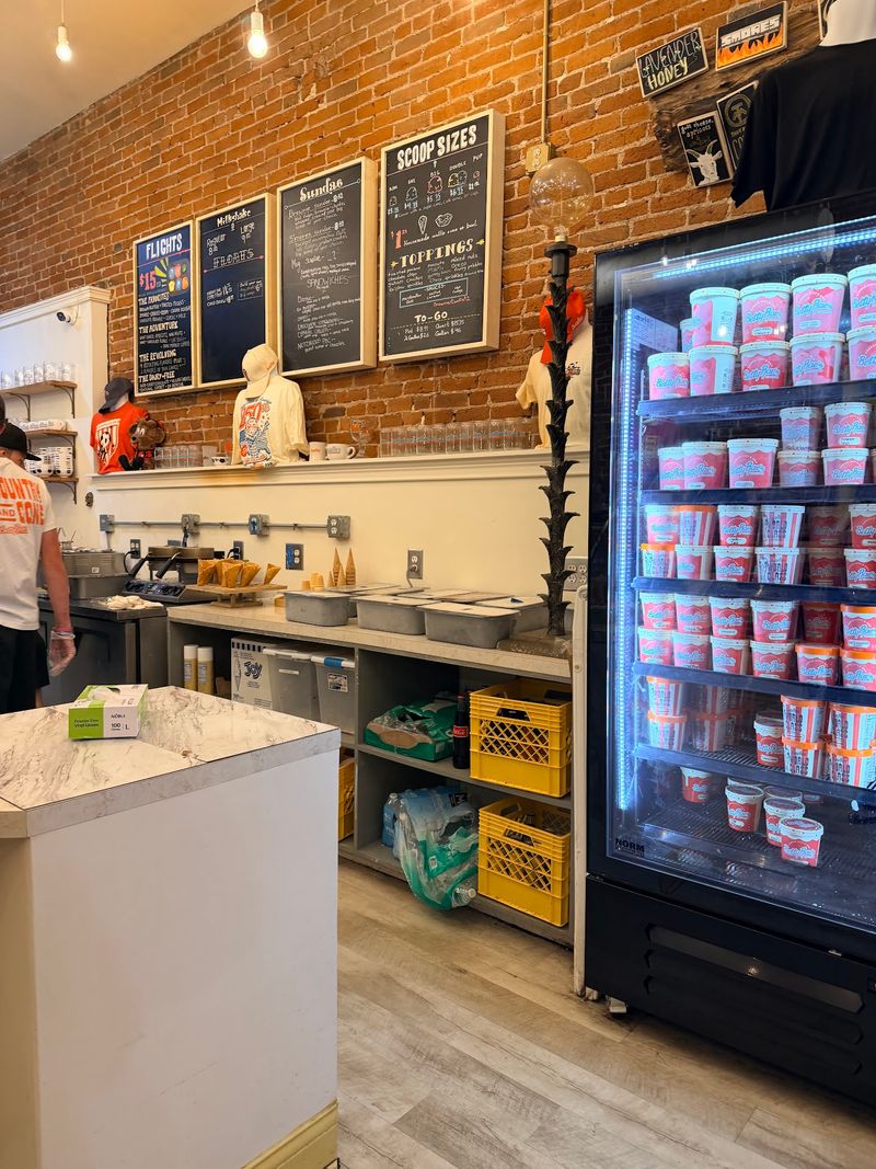 A Shop With Rainbow Walls And Red Brick