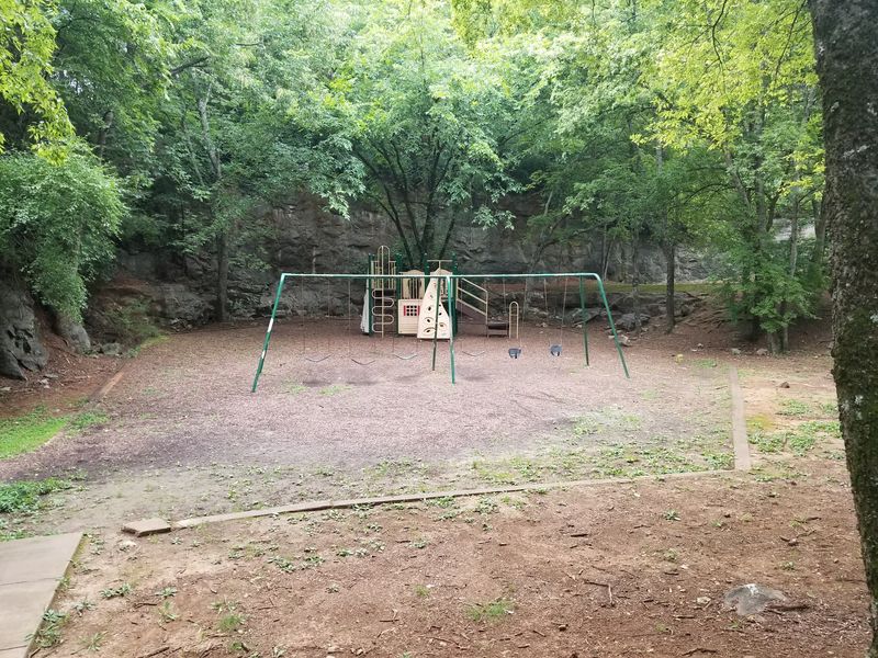 A Swing Set Tucked Inside Alabama's Oldest Cemetery A Swing Set Tucked Inside Alabama's Oldest Cemetery