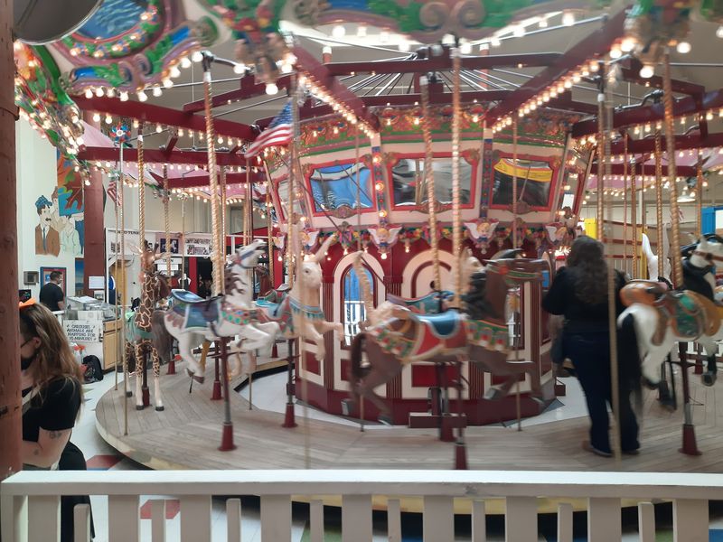 Arcade Bells And Carousel Horses On Broadway