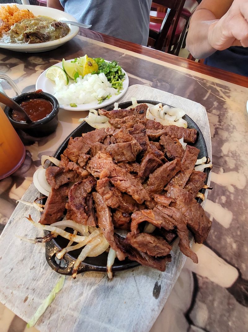 Barbacoa Cooked in Maguey Leaves Underground