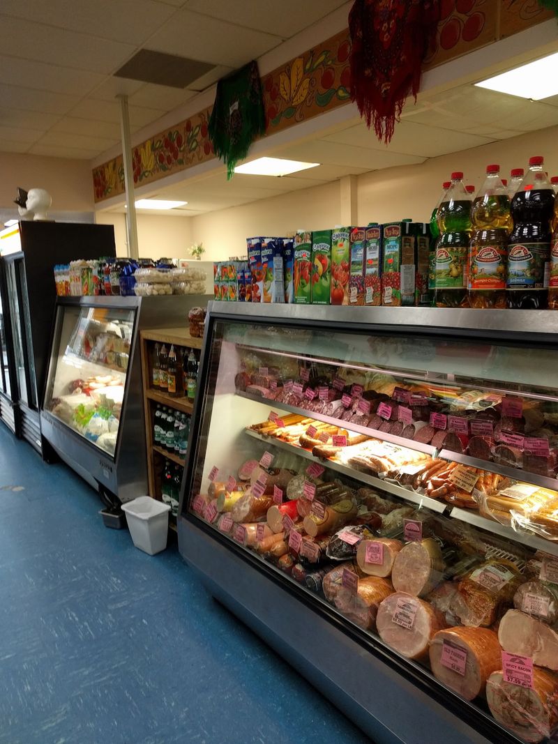 Deli Counter Loaded With Sausages, Cheeses, And Pickled Herring Deli Counter Loaded With Sausages, Cheeses, And Pickled Herring
