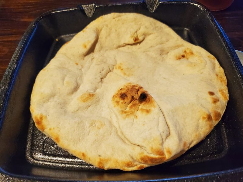 Fresh Pita Bread Puffing Up In The Oven