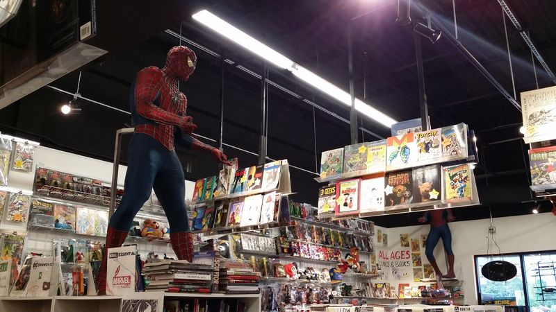 Neon Signs And A Life-Sized Spider-Man At The Door