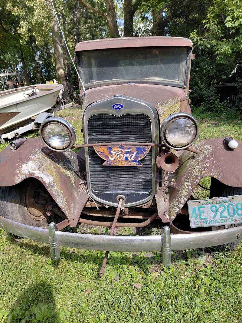 Old Cars Rusting Along the Driveway
