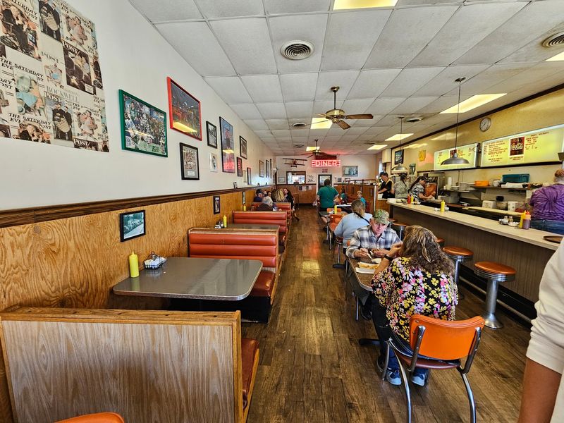 Orange Vinyl Booths And A Counter Full Of Swivel Stools