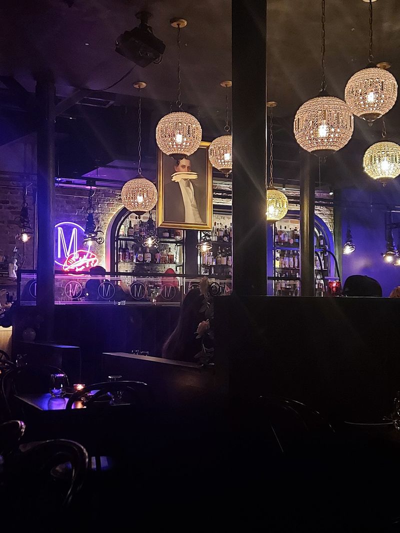 Purple Velvet Booths And Neon Glow