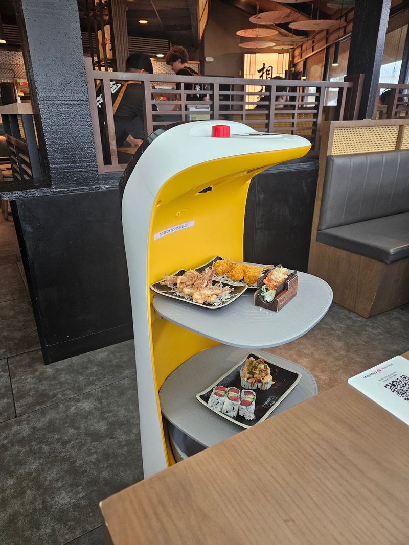 Robot Servers Rolling Between The Tables