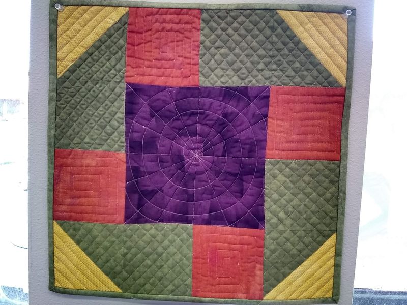 Sample Quilts Hanging Like Artwork On Every Wall