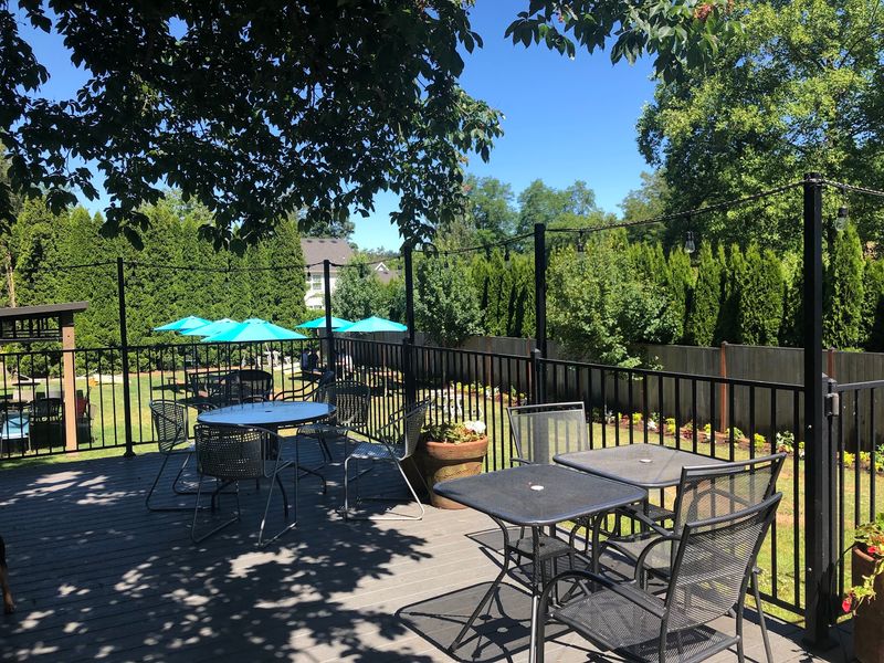 Shady Lawn Seating And A Deck Under The Trees