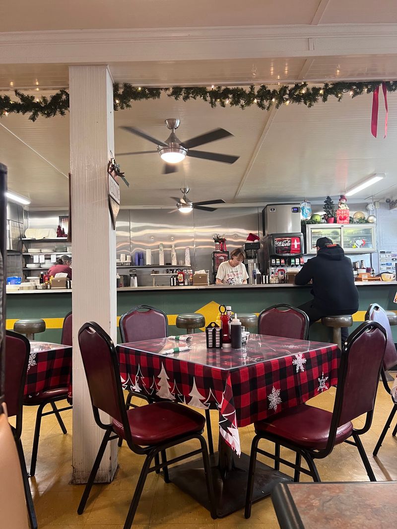 Spinning Stools, Chrome, And A Bright Yellow Counter