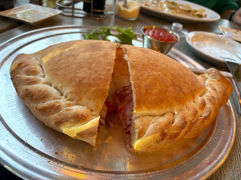 Stone-Oven Pizza and Calzones Worth Ordering Stone-Oven Pizza and Calzones Worth Ordering