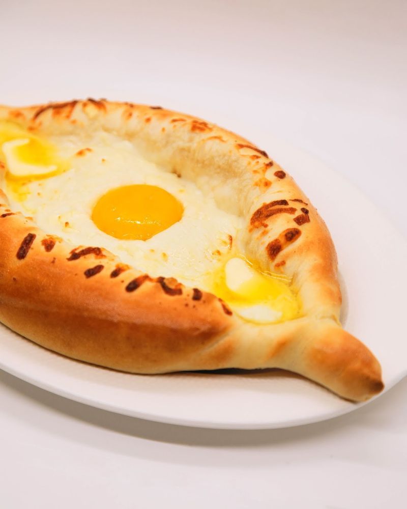 The Adjarian Khachapuri, Georgian Cheese Bread Shaped Like a Boat The Adjarian Khachapuri, Georgian Cheese Bread Shaped Like a Boat
