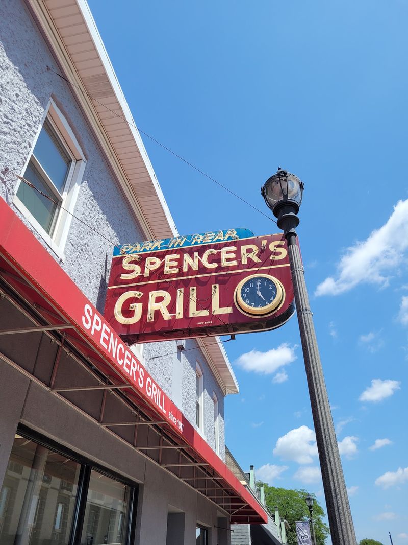The Neon Sign With A Clock Inside It