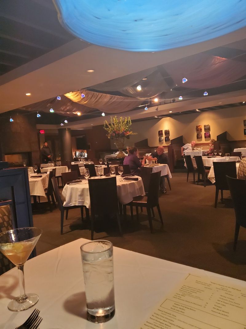 Three Fireplaces Glowing Through Dinner Service