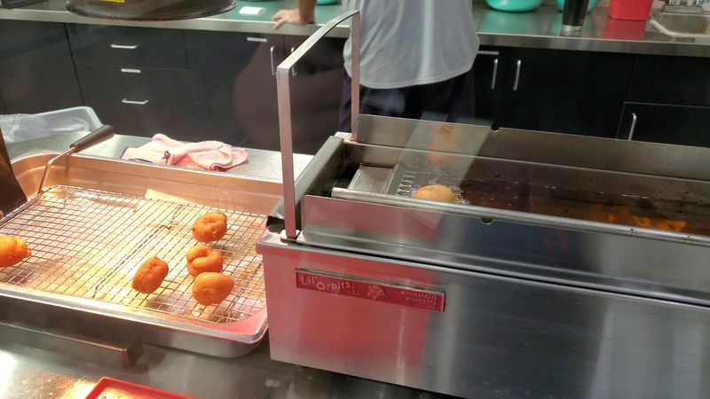 Watching Small Batches Hit The Fryer
