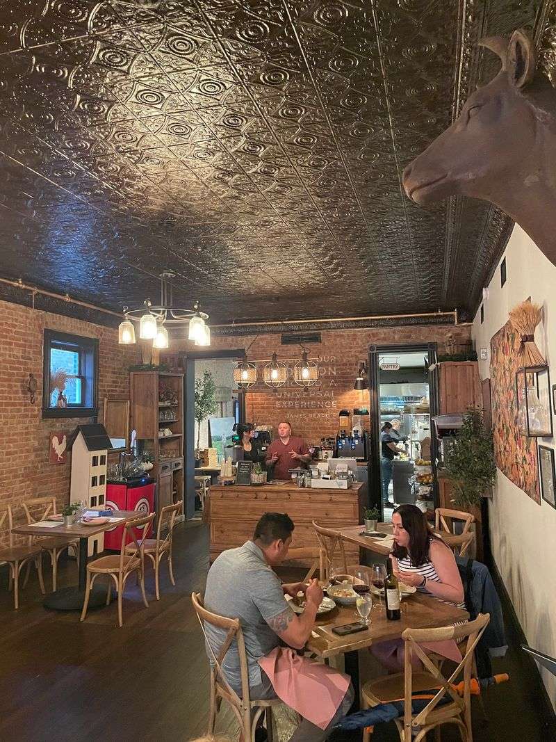 A Dining Room Built On Tin Ceilings And Wide Plank Floors