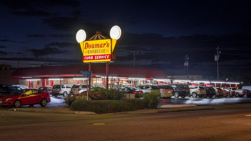 A Glowing Sign, Vintage Cars and Pure Drive-In Charm A Glowing Sign, Vintage Cars and Pure Drive-In Charm