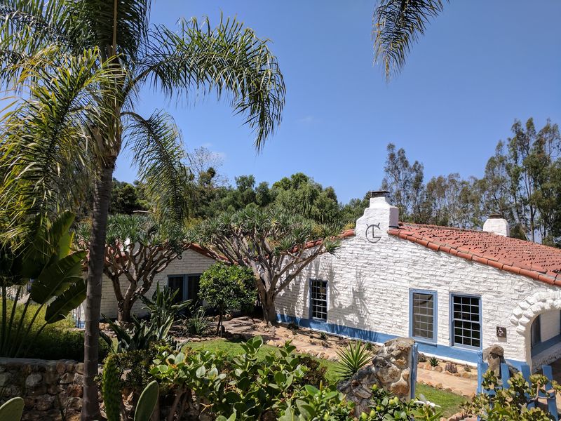 Adobe Walls, Red Tiles, and a Splash of Blue