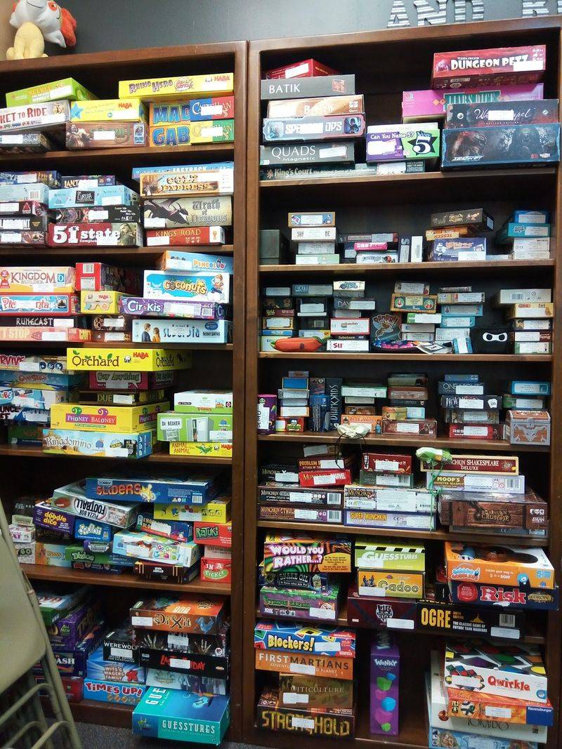 Board Games Stacked Like A Treasure Hoard