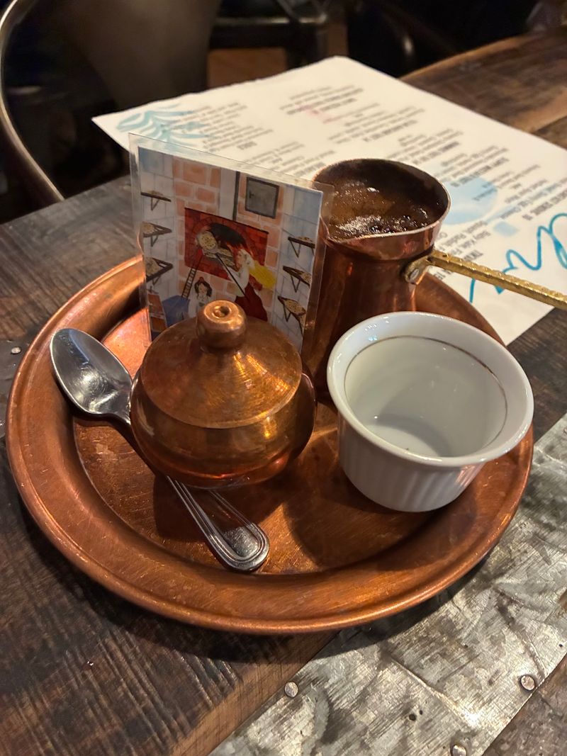 Bosnian Coffee Poured From A Shiny Copper Pot