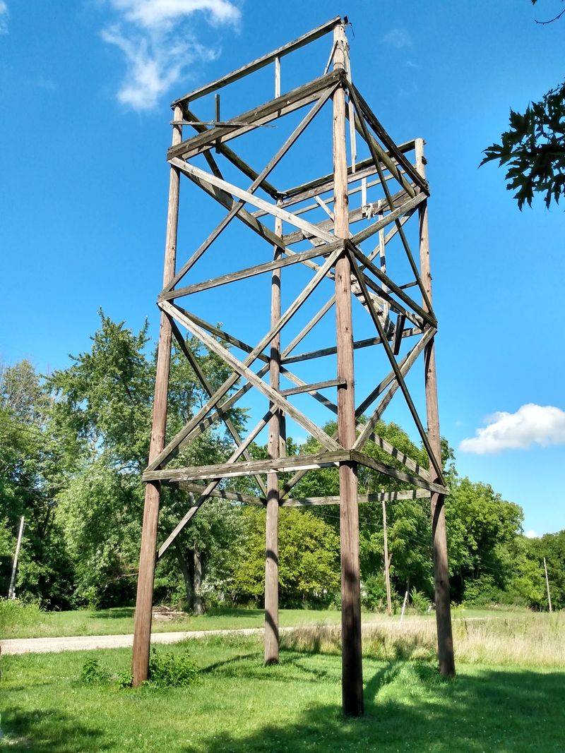 Four Utility Poles, One Very Small Cabin Four Utility Poles, One Very Small Cabin