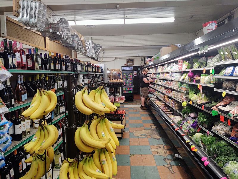 Produce, Groceries, and Everything Packed Into Tight Aisles