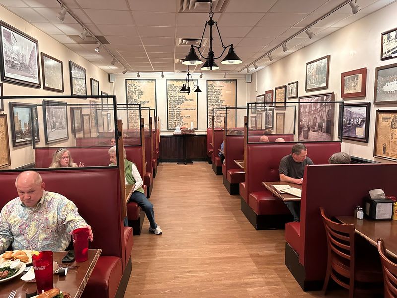 Red Booths, Old Photographs, and Walls Worth Reading Red Booths, Old Photographs, and Walls Worth Reading