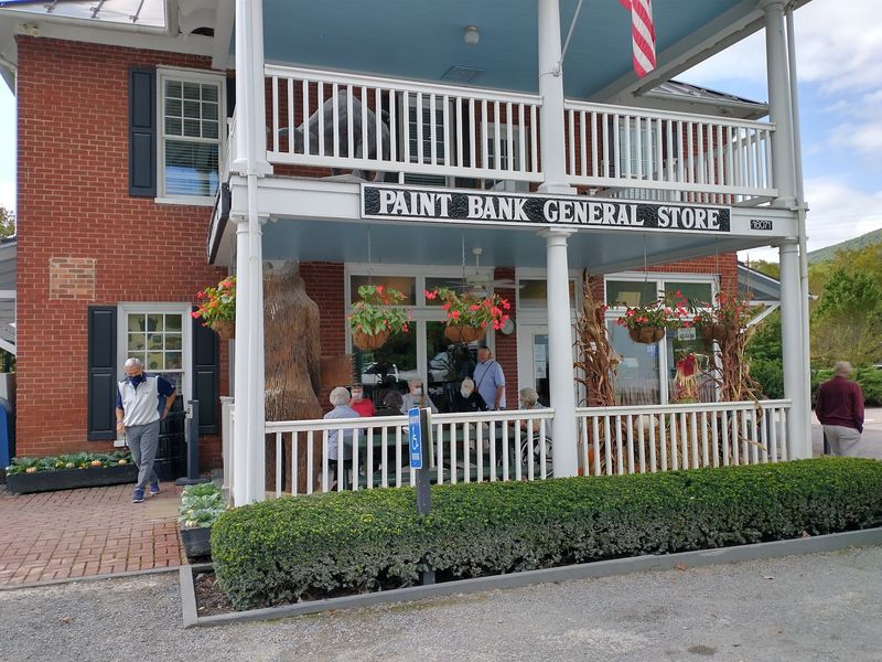 Rocking Chairs, Flower Baskets And A Porch That Sets The Mood