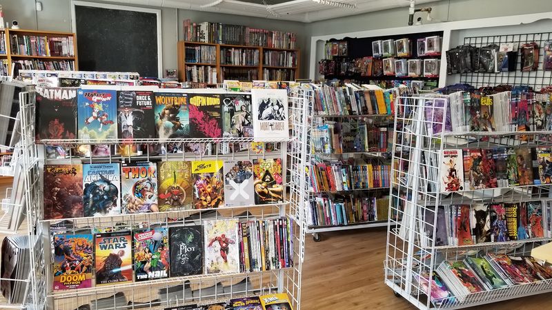 Shelves Stacked With DC, Marvel And Beyond Shelves Stacked With DC, Marvel And Beyond