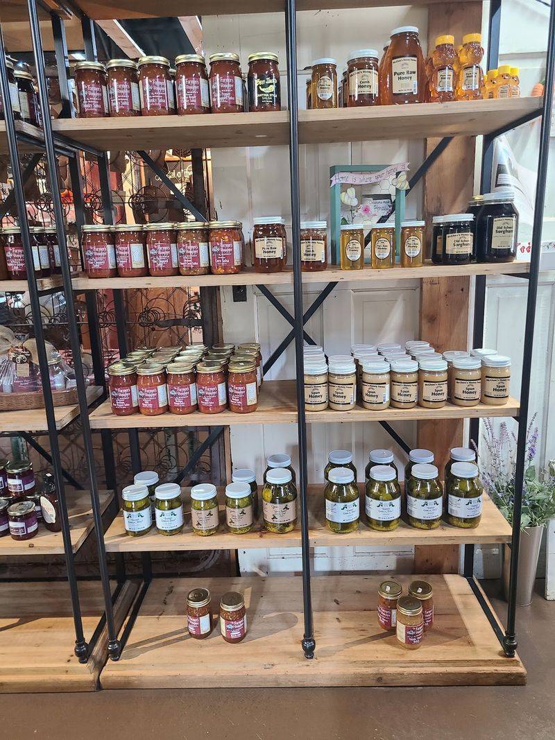 Shelves Stocked With Honey, Jams, And Jars You Did Not Plan To Buy