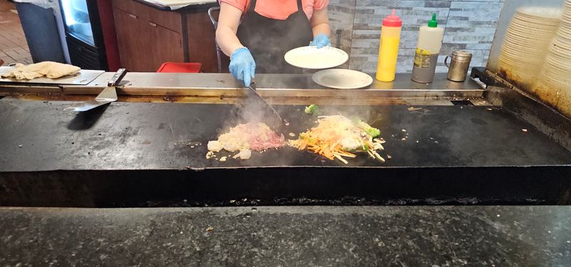 Sizzle, Steam, And A Hot Flat Grill