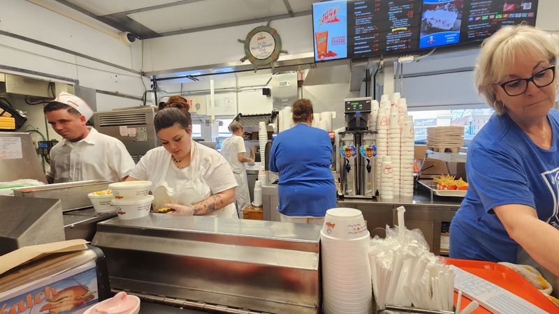 Staff in White Shirts and White Hats Staff in White Shirts and White Hats