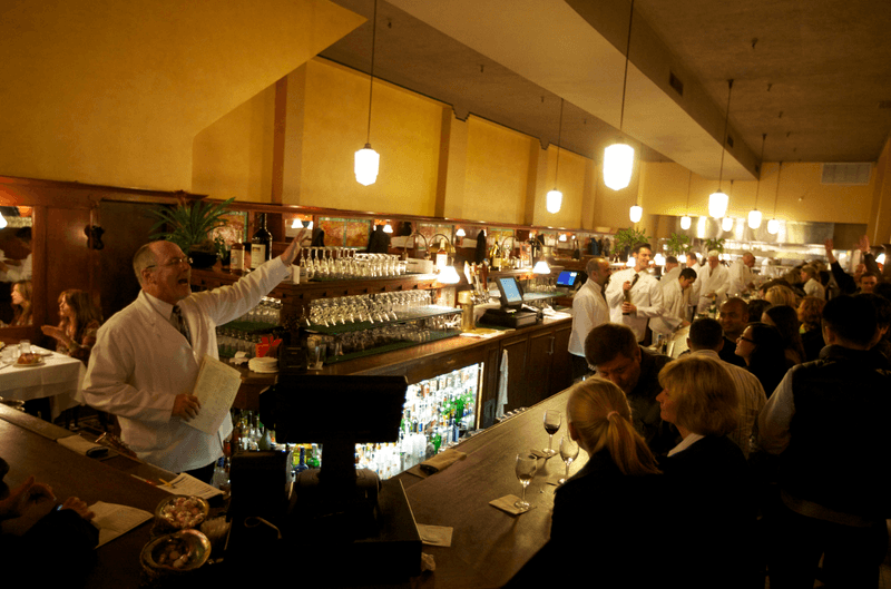 That 80-Foot Mahogany Bar Is the Heart of the Room That 80-Foot Mahogany Bar Is the Heart of the Room