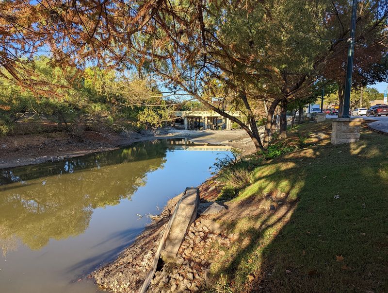 The Wooden Bridge Near City Park and Its Waterfall View