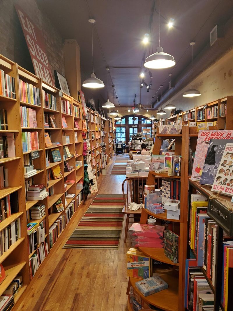 Wooden Shelves With Author Names Overhead