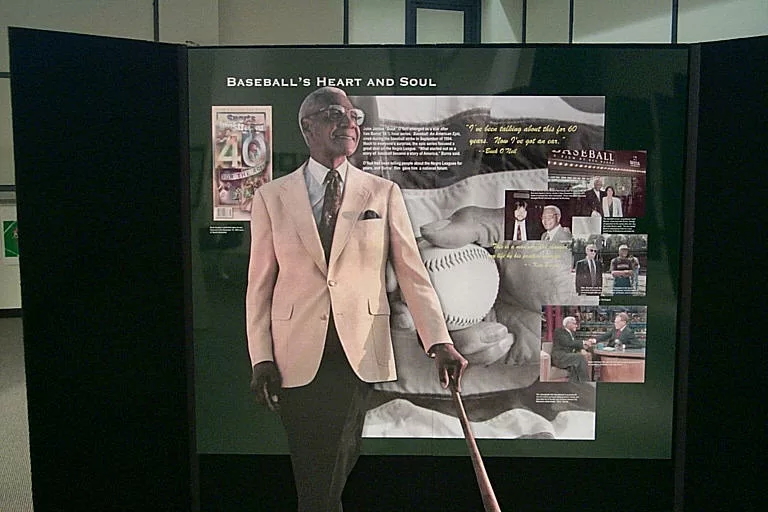 Buck with a bat in Section B of the Negro Leagues sports museum. Photo c. Kansas City Negro Leagues Baseball Museum.