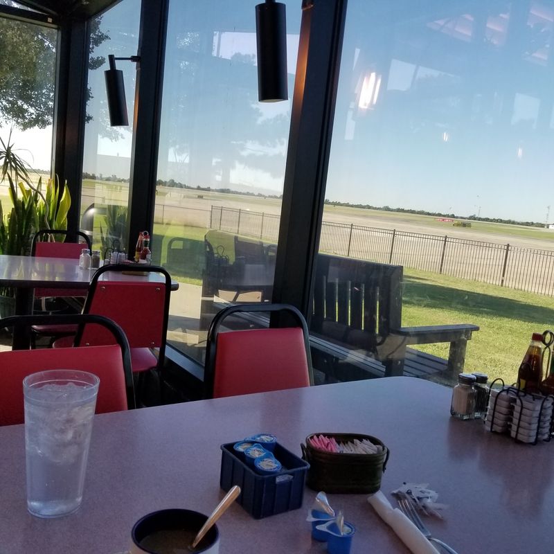 A Breakfast Counter Parked Beside an Airfield A Breakfast Counter Parked Beside an Airfield