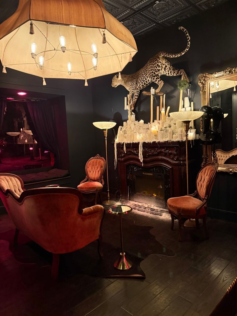 A Fireplace, Candles, and a Famous Goth Icon Greet You First
