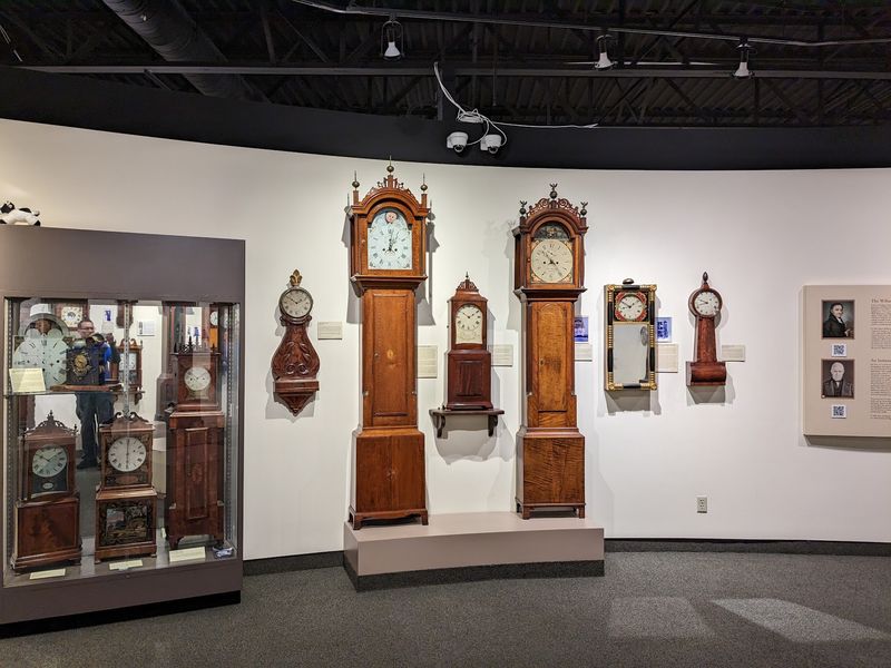 A Hallway Full of Grandfather Clocks A Hallway Full of Grandfather Clocks