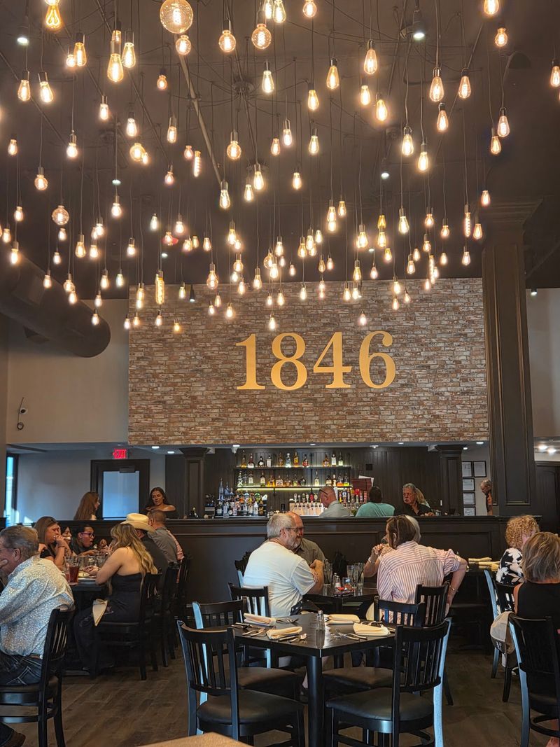 A Mahogany Door and Glowing Lanterns Set the Tone Outside