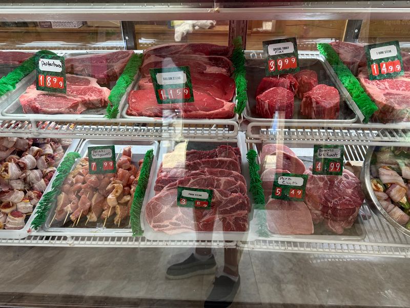 A Meat Counter Full Of Fresh Cuts