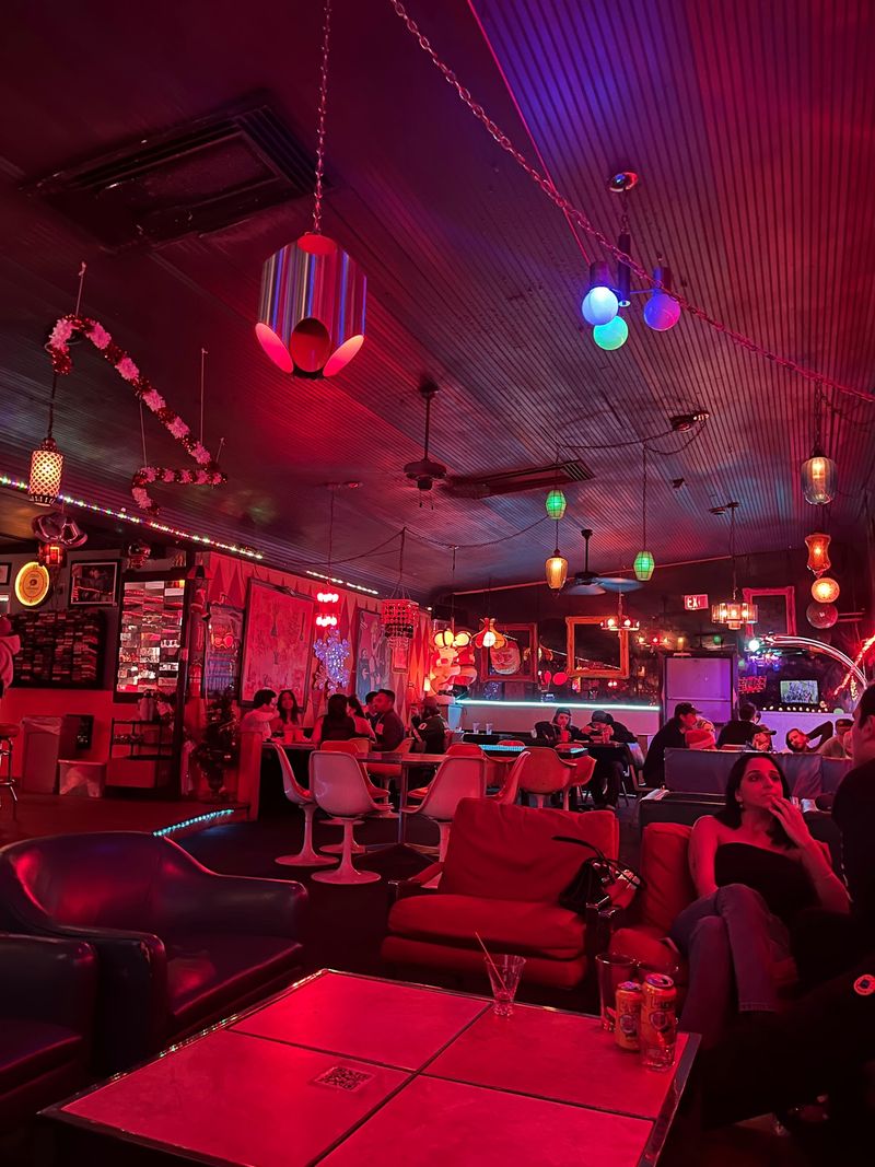 A Red-Lit Room That Feels Like A Retro Time Machine