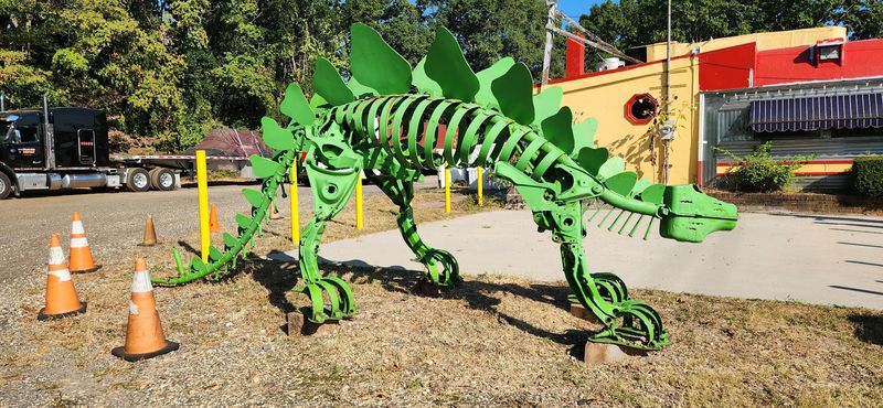 A Rusty Dinosaur Guarding the Parking Lot A Rusty Dinosaur Guarding the Parking Lot