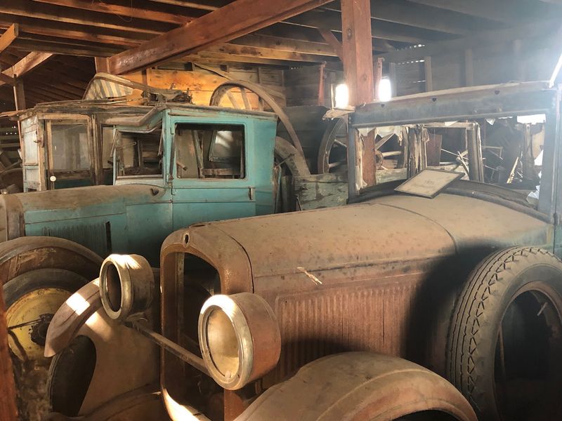 A Schoolhouse, a Water Tower, and a Barn Full of Old Cars