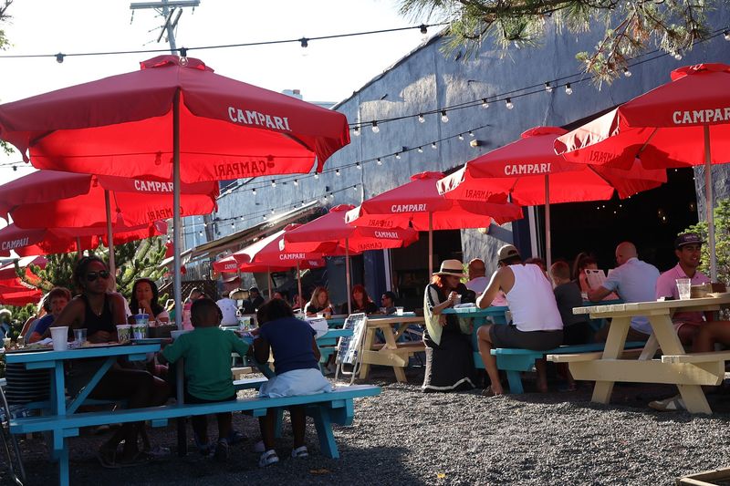 Bocce, Birch Trees, And Red Umbrellas Await Outside Bocce, Birch Trees, And Red Umbrellas Await Outside