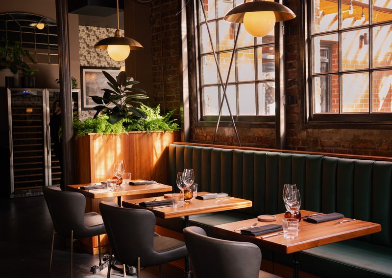Booths, Soft Chairs, And A Room Made For Lingering