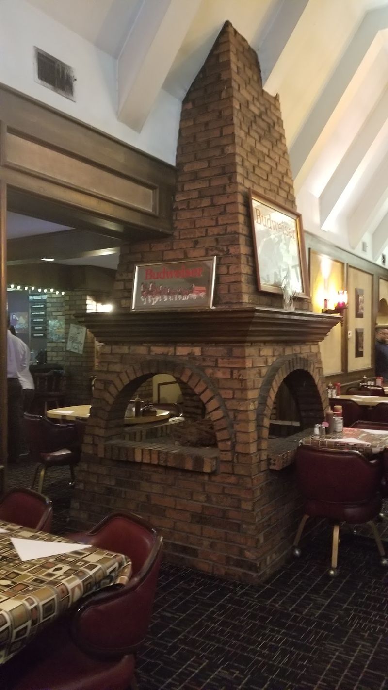 Cozy Up By The Fireplace In The Lounge