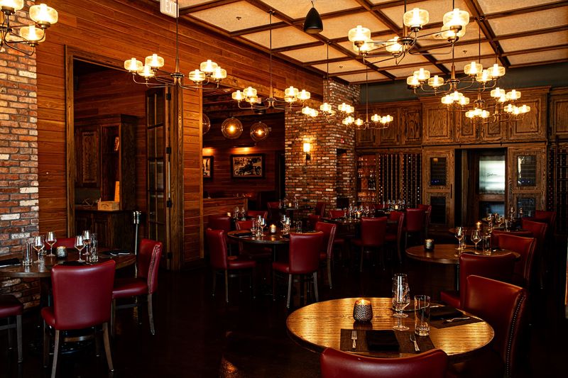 Crimson Leather And Exposed Brick Set A Cozy Mood